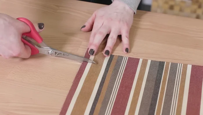 Sew along the edges of the velcro on the bottom piece. Fold the end in half an inch and sew on the velcro.