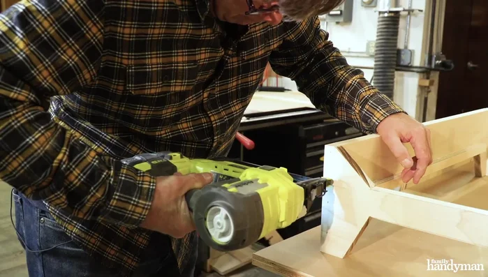 Assemble the frame: Attach the side legs to the back legs, then attach the front legs to the side legs. Apply glue to the top of all four cleats, place the plywood bottom on top, and attach it with nails.