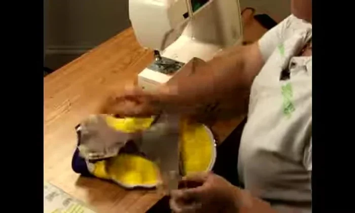 Position Velcro on both sides of the coat, ensuring you don't place two of the same side together.