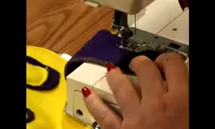 Begin sewing at the edge of the Velcro. It's crucial to backstitch 5-6 times at the beginning and end to secure the Velcro due to the stress it will endure.