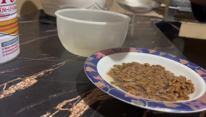 Soften cat biscuits by adding the reserved broth (yakhni). Allow them to sit for 5-10 minutes to absorb the liquid.