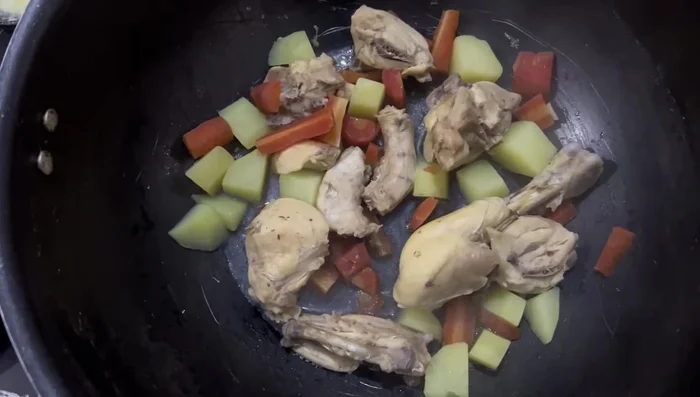Shred the cooked chicken and add it to the mixture. Mix thoroughly.