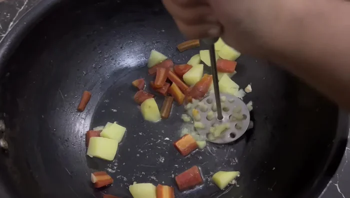 Shred the cooked chicken and add it to the mixture. Mix thoroughly.