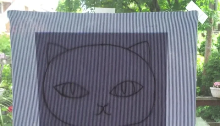 Tape the fabric tightly to a surface to prevent wrinkles while tracing.